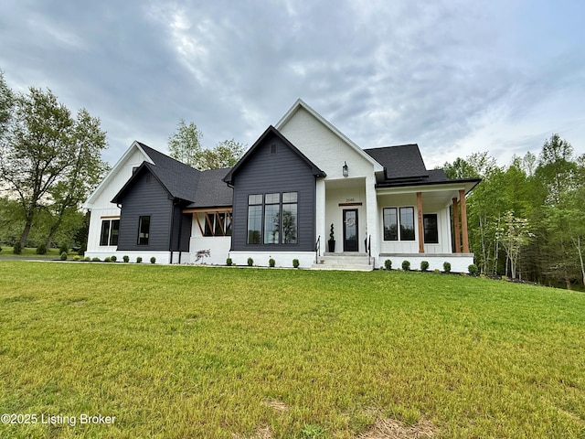 2045 W Rhudes Creek Rd, Elizabethtown, KY 42701 - view of front of home with a shingled roof, covered porch, and a front yard