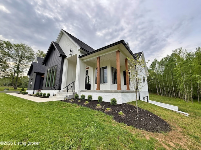 2045 W Rhudes Creek Rd, Elizabethtown, KY 42701 - view of front facade with board and batten siding, roof with shingles, a porch, and a front yard