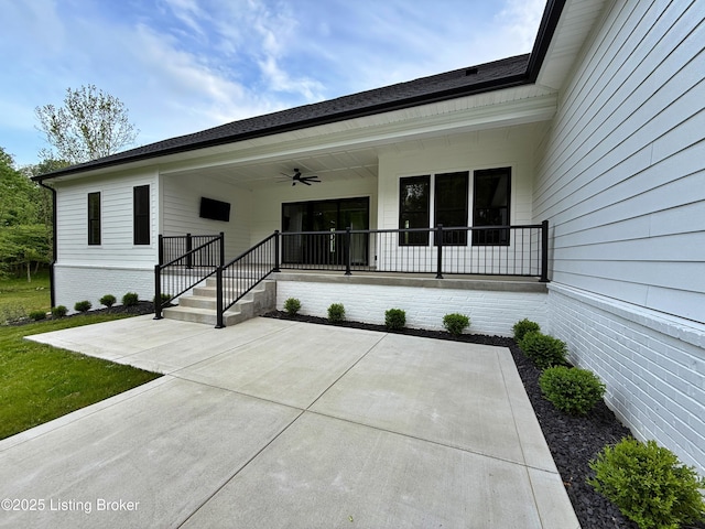 2045 W Rhudes Creek Rd, Elizabethtown, KY 42701 - property entrance with brick siding, ceiling fan, and covered porch