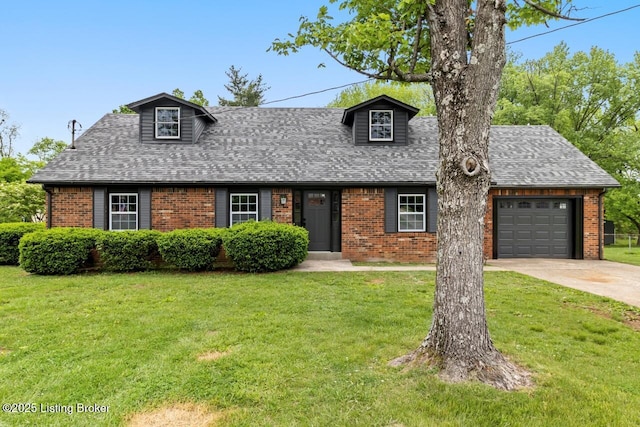 cape cod home featuring a shingled roof, a front yard, and brick siding