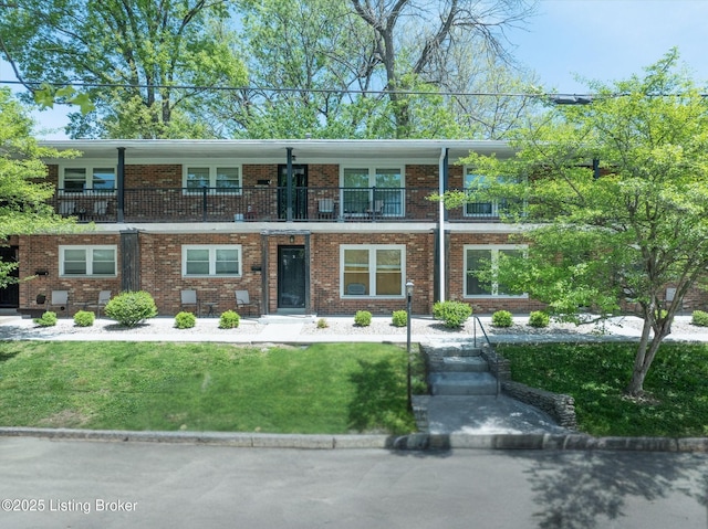 2100 Murray Ave, Louisville, KY 40205 - view of front of property with brick siding, a front lawn, and a balcony
