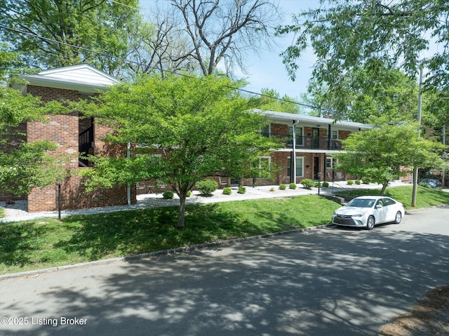 2100 Murray Ave, Louisville, KY 40205 - view of front of home with brick siding, a balcony, and a front lawn