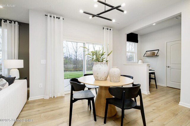 2309 Serenity Rdg Way, Louisville, KY 40023 - dining space with recessed lighting, baseboards, a chandelier, and light wood-type flooring