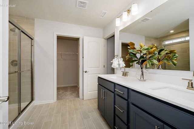 2309 Serenity Rdg Way, Louisville, KY 40023 - full bathroom featuring a sink, a stall shower, and visible vents
