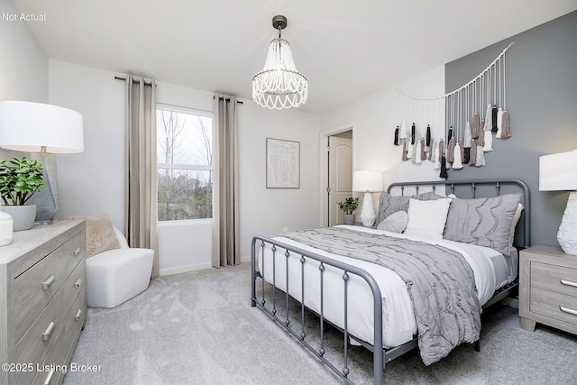 bedroom featuring an inviting chandelier, baseboards, and light carpet