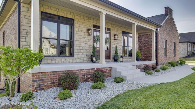 157 Tommy Ct, Shepherdsville, KY 40165 - doorway to property with covered porch, a chimney, and brick siding