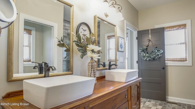 157 Tommy Ct, Shepherdsville, KY 40165 - full bathroom featuring double vanity, baseboards, visible vents, and a sink