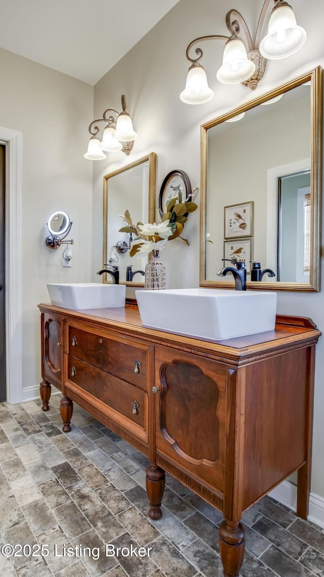 157 Tommy Ct, Shepherdsville, KY 40165 - bathroom featuring vanity, baseboards, and stone tile flooring