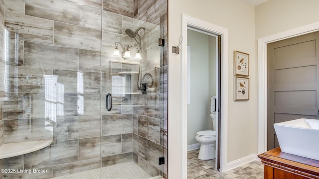 157 Tommy Ct, Shepherdsville, KY 40165 - full bathroom featuring a sink, baseboards, a shower stall, and toilet