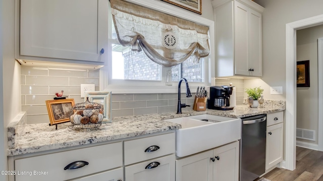 157 Tommy Ct, Shepherdsville, KY 40165 - kitchen featuring tasteful backsplash, stainless steel dishwasher, light stone countertops, a sink, and white cabinetry
