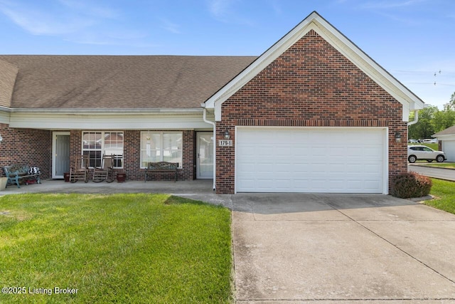 view of front of property featuring driveway, a front yard, a garage, brick siding, and a shingled roof