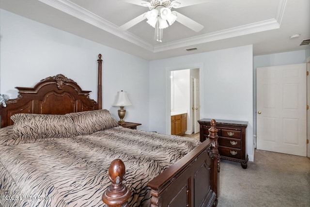 bedroom with light colored carpet, ornamental molding, a raised ceiling, and visible vents
