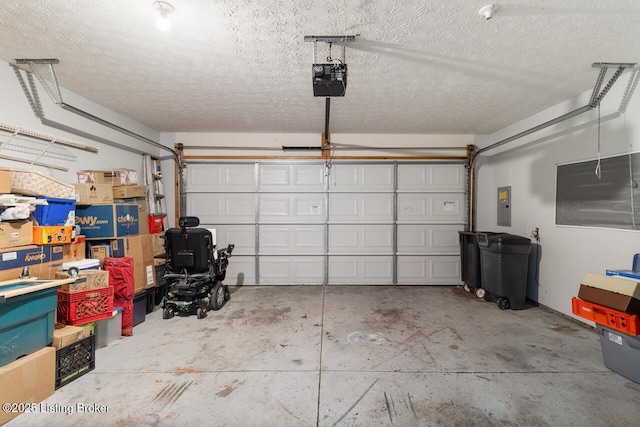 garage featuring a garage door opener and electric panel