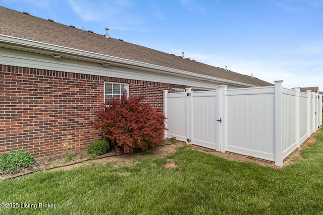 view of yard featuring a gate and fence