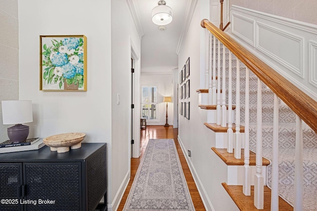 1203 Winding Creek Pl, Louisville, KY 40245 - corridor featuring crown molding, baseboards, wood finished floors, and stairway
