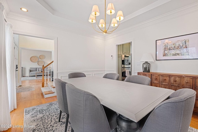 1203 Winding Creek Pl, Louisville, KY 40245 - dining area featuring an inviting chandelier, ornamental molding, light wood-style flooring, and wainscoting