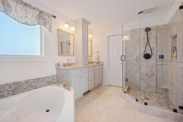 1203 Winding Creek Pl, Louisville, KY 40245 - bathroom featuring double vanity, a stall shower, a garden tub, and a sink