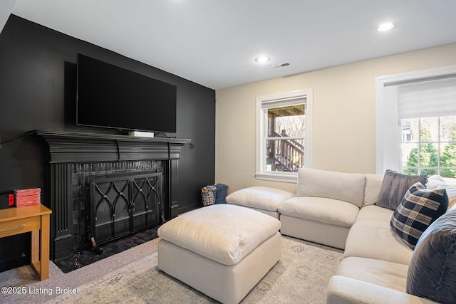 1203 Winding Creek Pl, Louisville, KY 40245 - carpeted living room with visible vents, a fireplace with flush hearth, and recessed lighting