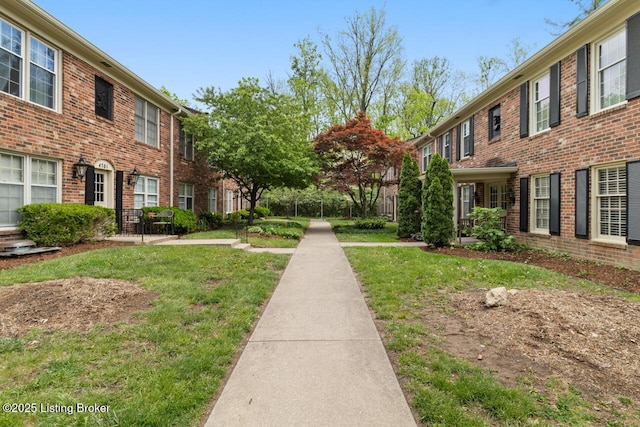 exterior space with a residential view and a lawn