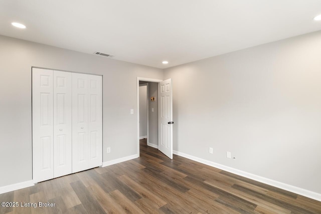 unfurnished bedroom with visible vents, wood finished floors, and recessed lighting