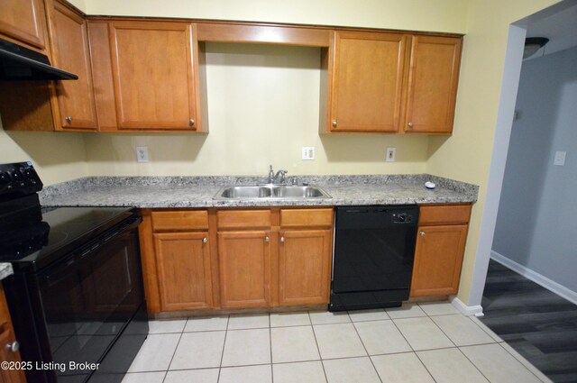 404 La Fontenay Ct, Louisville, KY 40223 - kitchen featuring a sink, light countertops, brown cabinetry, under cabinet range hood, and black appliances