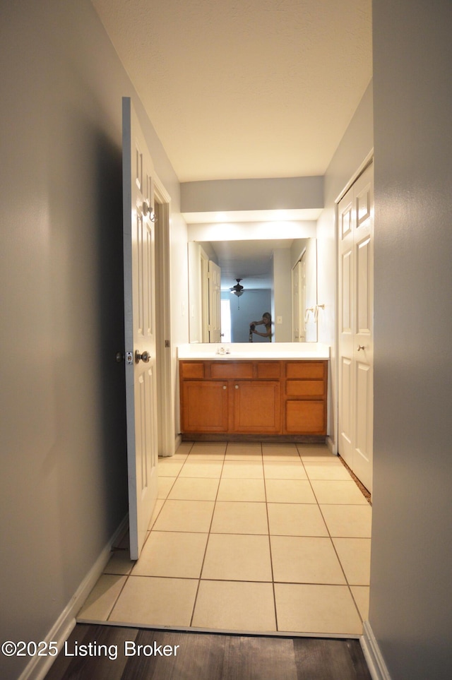404 La Fontenay Ct, Louisville, KY 40223 - bathroom with double vanity, baseboards, and tile patterned flooring