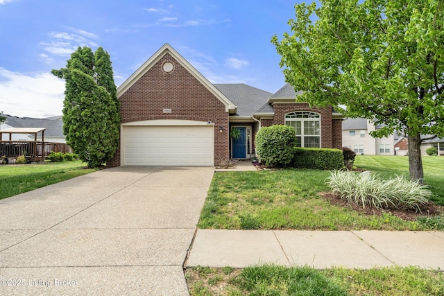 view of front of property with an attached garage, driveway, a front lawn, and brick siding