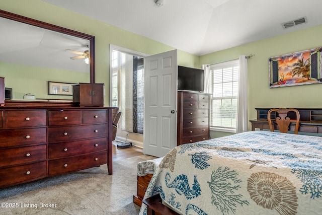 carpeted bedroom featuring visible vents and lofted ceiling