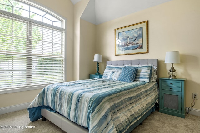 carpeted bedroom with baseboards