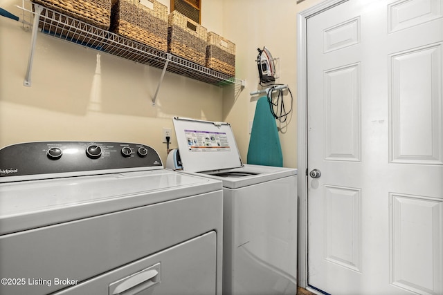 laundry room with laundry area and washer and clothes dryer
