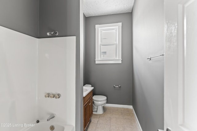 full bathroom featuring washtub / shower combination, tile patterned flooring, vanity, toilet, and baseboards