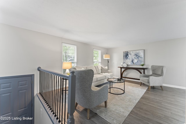 living room featuring baseboards and wood finished floors