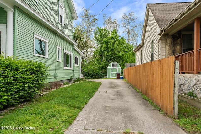 717 Highland Ave, Carrollton, KY 41008 - view of home's exterior featuring fence, an outdoor structure, and a storage unit