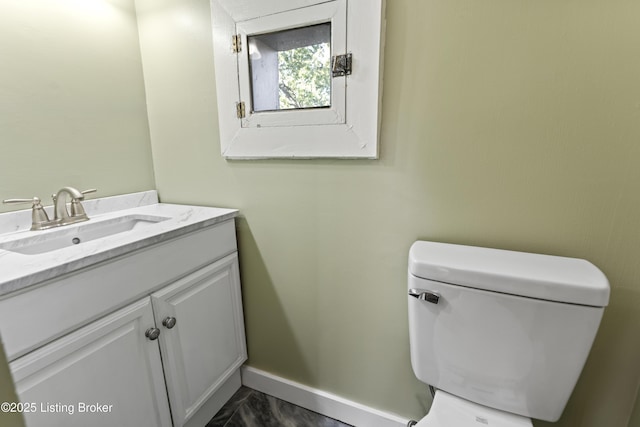 1332 S 2nd St, Louisville, KY 40208 - bathroom featuring vanity, baseboards, toilet, and marble finish floor