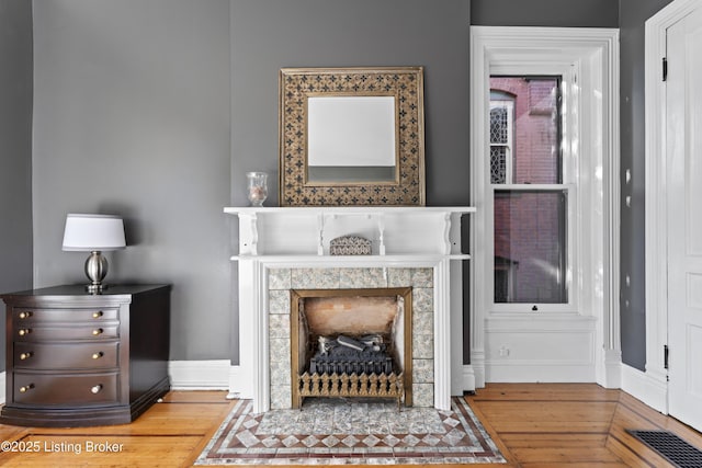 1332 S 2nd St, Louisville, KY 40208 - interior space with visible vents, baseboards, wood finished floors, and a fireplace