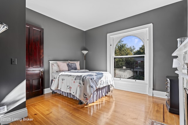1332 S 2nd St, Louisville, KY 40208 - bedroom featuring baseboards and wood finished floors