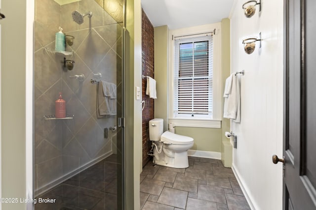 1332 S 2nd St, Louisville, KY 40208 - bathroom with baseboards, stone finish floor, toilet, and a shower stall