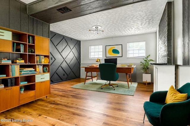 office area with wood finished floors and baseboards