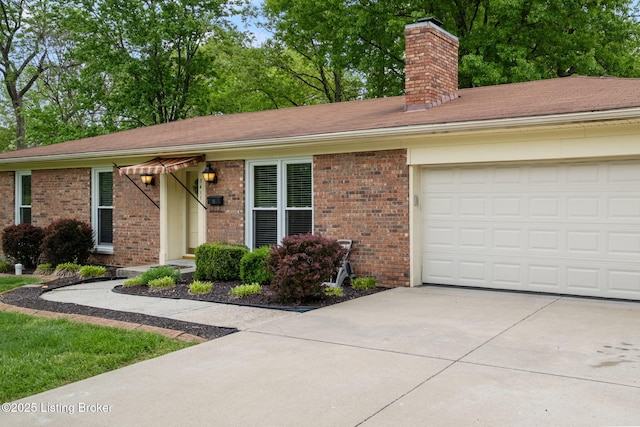 7411 Colt Dr, Louisville, KY 40214 - single story home with brick siding, driveway, a chimney, and a garage