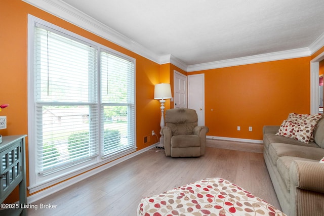 7411 Colt Dr, Louisville, KY 40214 - living area featuring crown molding, baseboards, a wealth of natural light, and wood finished floors