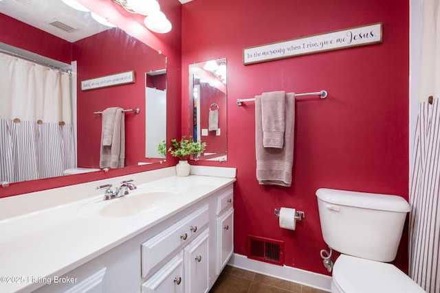 7411 Colt Dr, Louisville, KY 40214 - bathroom featuring tile patterned floors, vanity, toilet, and visible vents