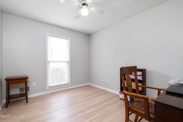 7411 Colt Dr, Louisville, KY 40214 - home office with baseboards, a ceiling fan, light wood finished floors, and visible vents