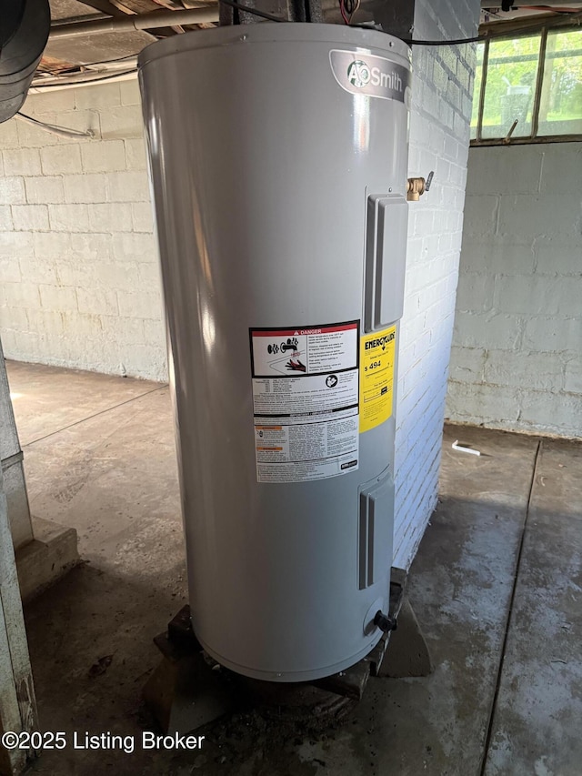 utility room featuring electric water heater