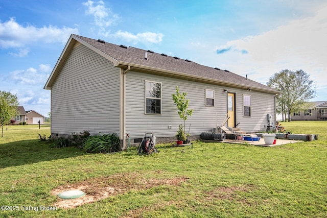 450 Rolling Way, Smiths Grove, KY 42171 - back of house featuring a lawn, roof with shingles, and a patio area
