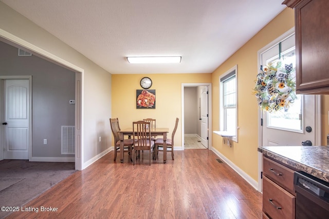 450 Rolling Way, Smiths Grove, KY 42171 - dining space with baseboards, wood finished floors, and visible vents