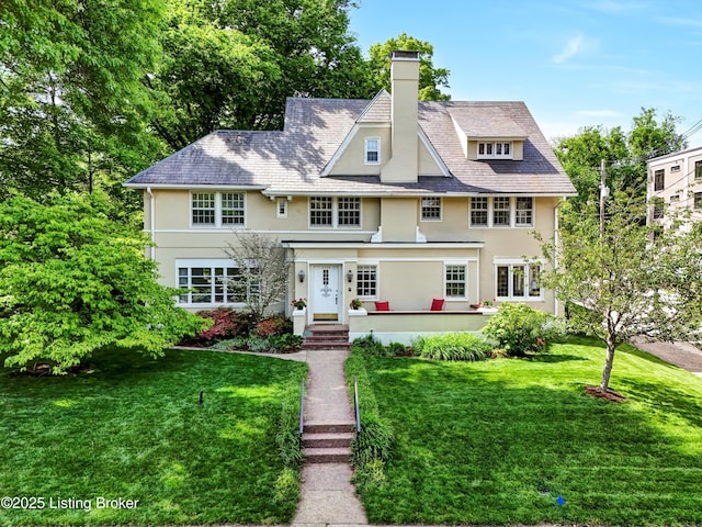 2335 Bonnycastle Ave, Louisville, KY 40205 - shingle-style home with stucco siding, a chimney, and a front yard