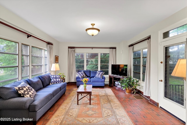 2335 Bonnycastle Ave, Louisville, KY 40205 - living area with plenty of natural light, brick flooring, and baseboards