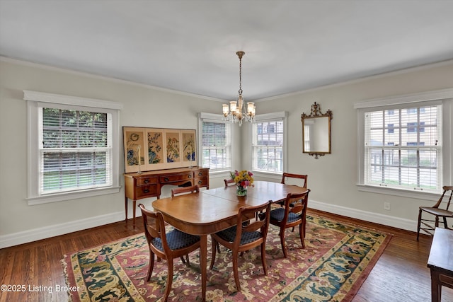 2335 Bonnycastle Ave, Louisville, KY 40205 - dining area featuring a chandelier, plenty of natural light, ornamental molding, baseboards, and wood finished floors