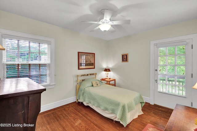 2335 Bonnycastle Ave, Louisville, KY 40205 - bedroom featuring wood finished floors, multiple windows, and baseboards