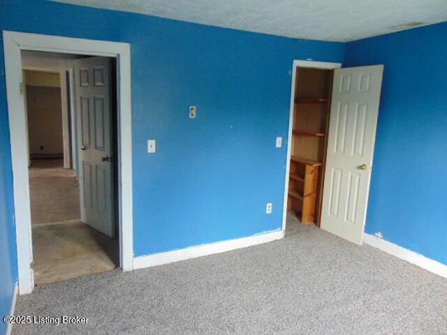 unfurnished bedroom with baseboards and carpet floors